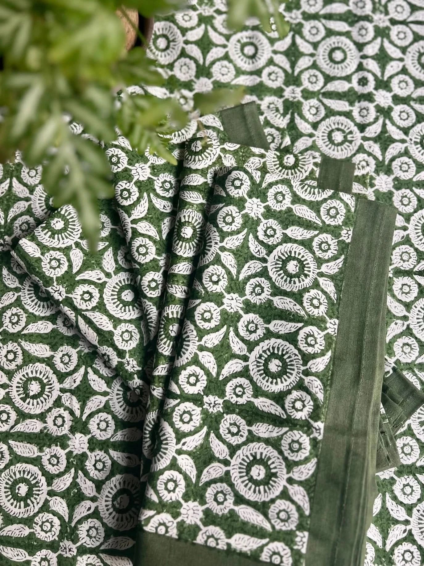 Set of four Feathered Tile Napkins by Christina Dickson Home featuring elegant feathered tile pattern in soft, neutral tones.