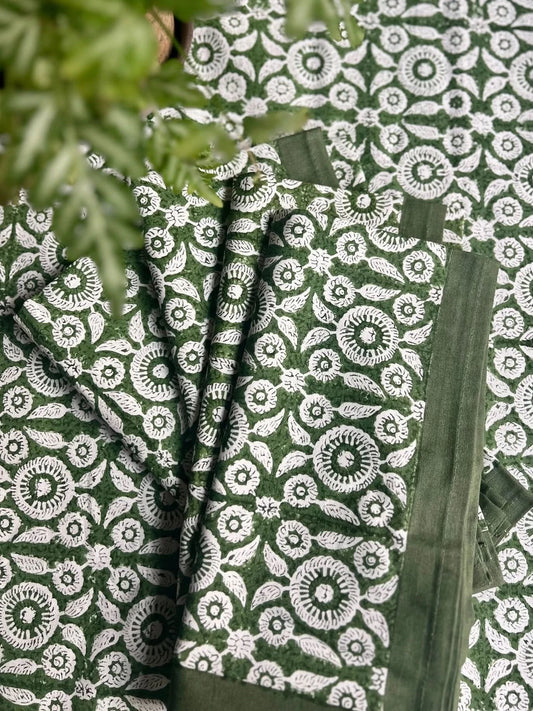 Set of four Feathered Tile Napkins by Christina Dickson Home featuring elegant feathered tile pattern in soft, neutral tones.