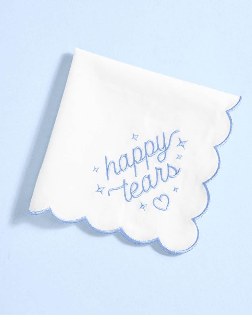 White embroidered handkerchief with "Happy Tears" design from xo, Fetti, featuring delicate embroidery on soft fabric.
