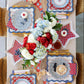 My Mind’s Eye floral table runner with colorful, intricate flower patterns on fabric for decorative dining table accents.