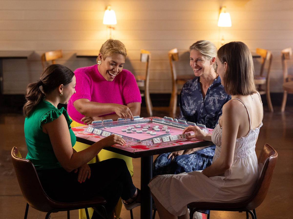 Pink Mahjong mat featuring a floral rose pattern, perfect for playing traditional Mahjong games at home.