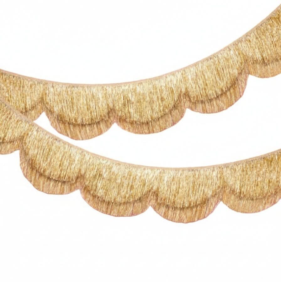 Gold scallop fringe banner by xo, Fetti with shimmering gold scalloped fabric and long fringe for festive decorations.