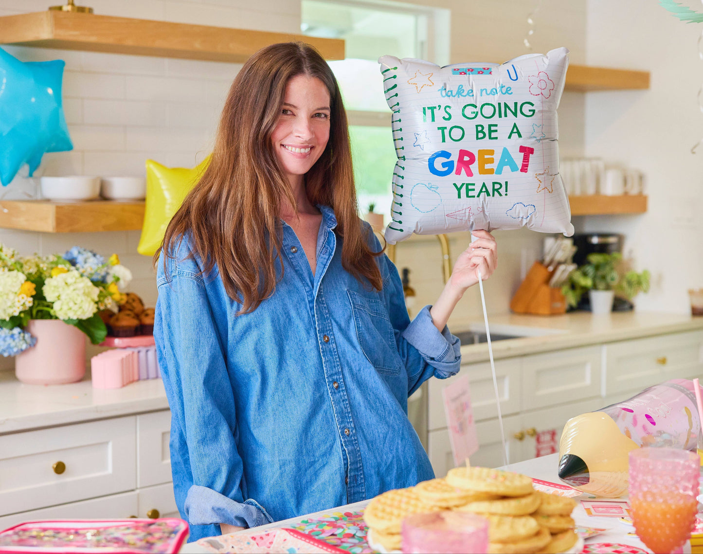 Packed Party Take Note Back to School Balloon Kit with colorful letter and star-shaped balloons for celebrating the new school year.