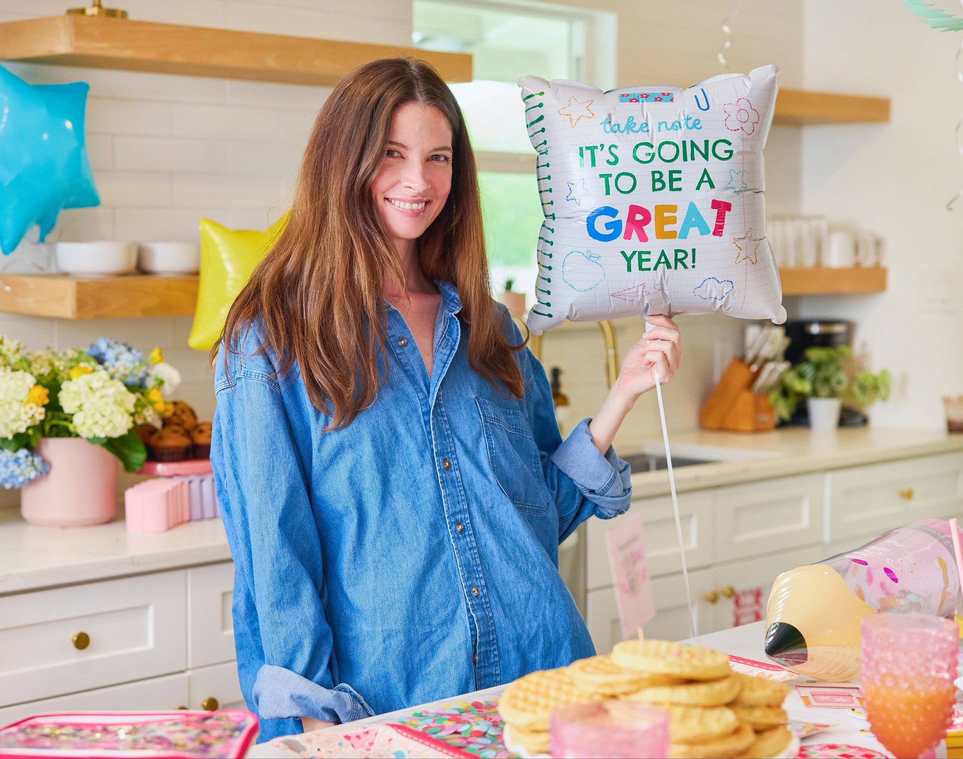 Packed Party Take Note Back to School Balloon Kit with colorful letter and star-shaped balloons for celebrating the new school year.