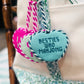 Southern Decorative Besties Who Mahjong needlepoint bag charm featuring colorful embroidered designs on a small accessory.