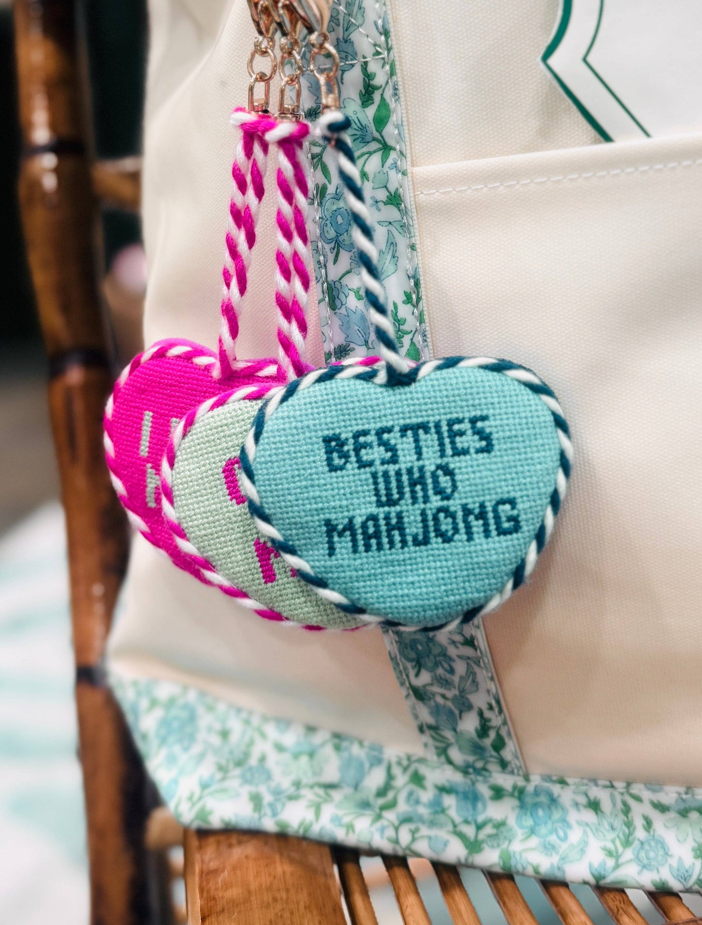 Southern Decorative Besties Who Mahjong needlepoint bag charm featuring colorful embroidered designs on a small accessory.