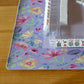 Lavender floral mat by Hutch and Nook featuring a soft fabric with a purple and green floral pattern.