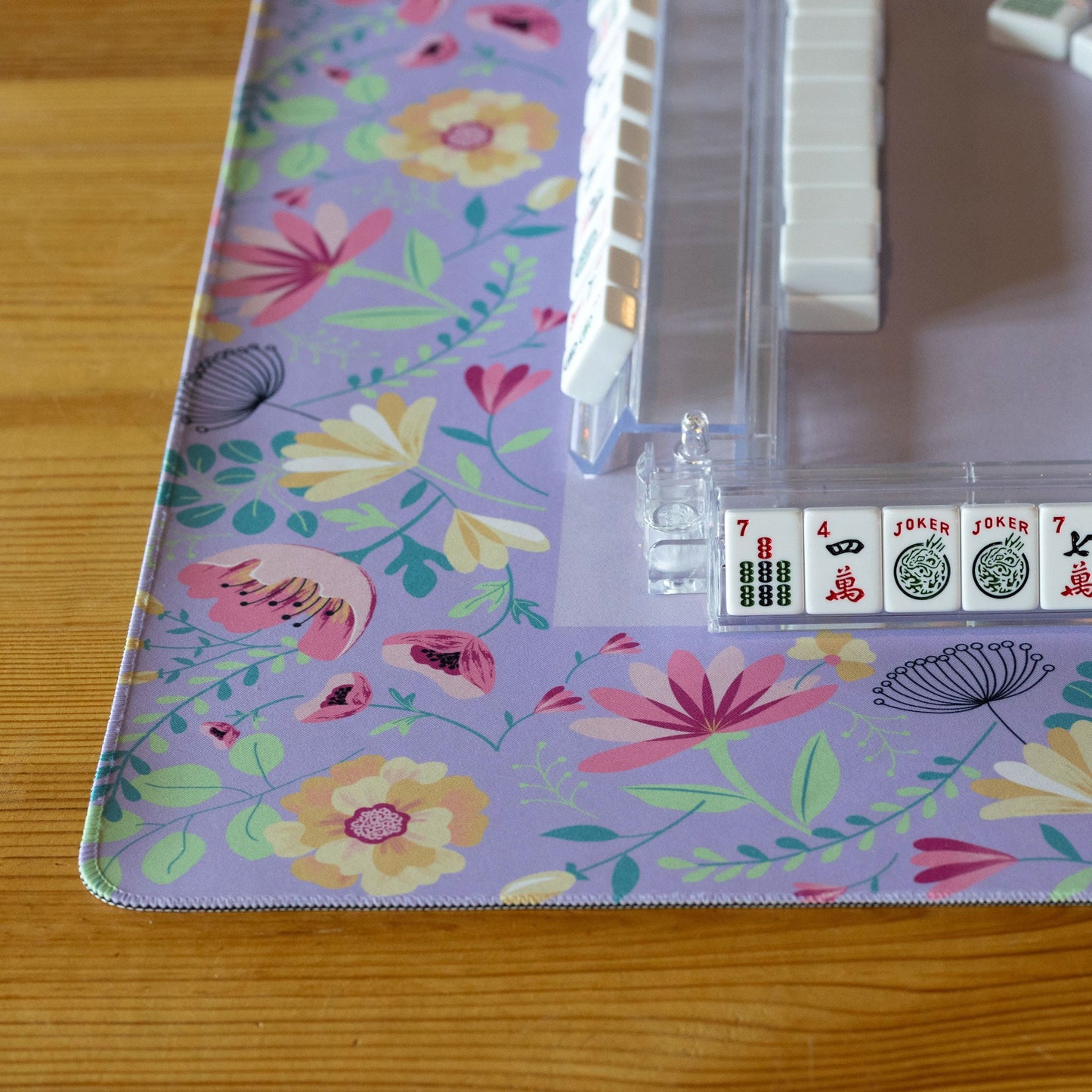Lavender floral mat by Hutch and Nook featuring a soft fabric with a purple and green floral pattern.