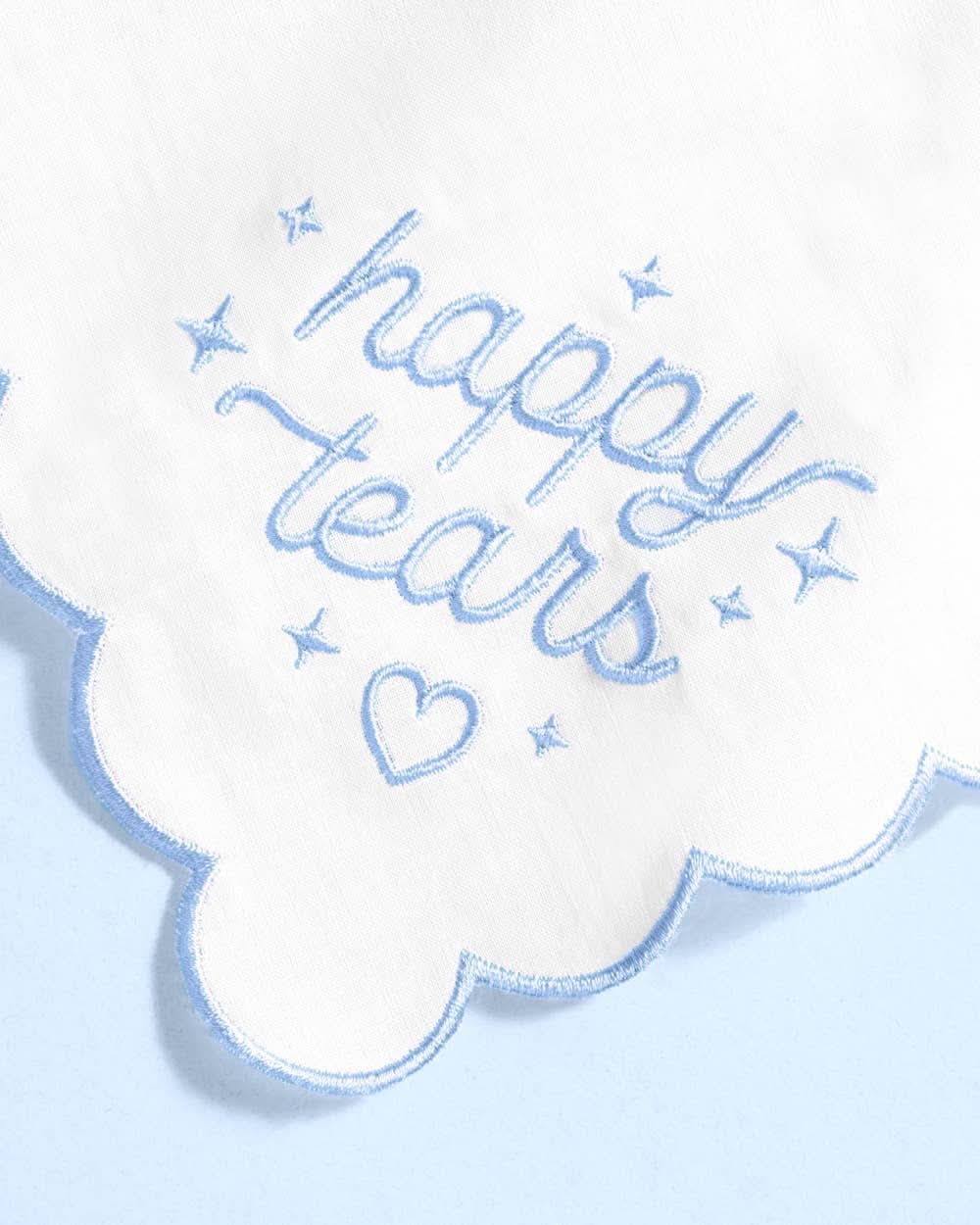 Embroidered Happy Tears handkerchief by xo, Fetti with delicate embroidery and soft fabric, laid flat against a neutral background.