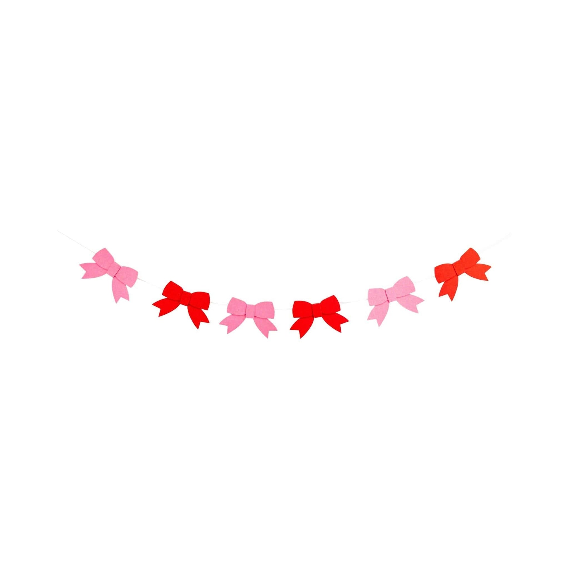 Pink and red felt bow banner for Valentine’s Day, featuring multiple bows on a string, by My Mind’s Eye.