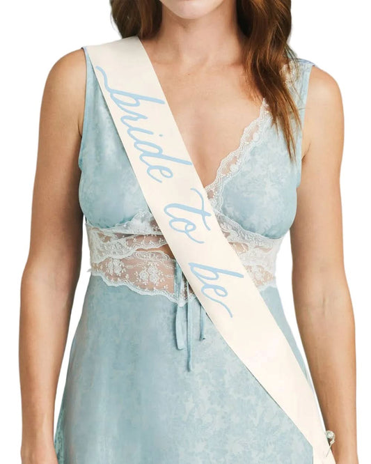 Bride to Be sash by xo, Fetti with white fabric and gold lettering for wedding celebrations.