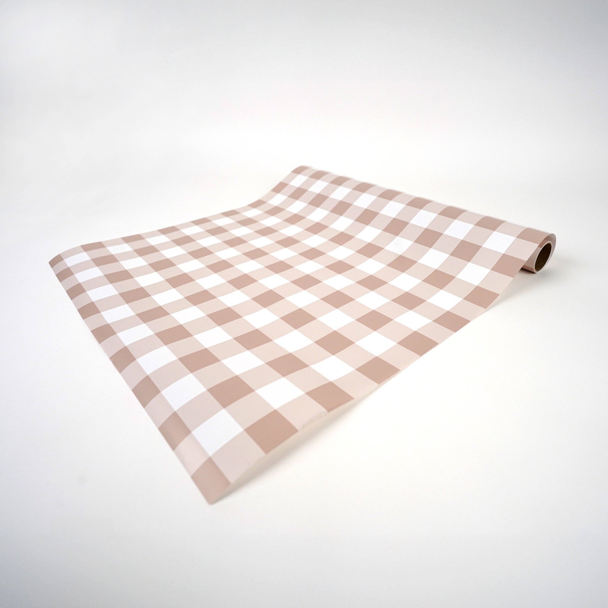 Brown gingham paper table runner by Gatherings by Curated Paperie, featuring a classic checkered pattern on lightweight paper.