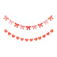 My Mind’s Eye Bow and Heart banner set with colorful paper banners and string for celebration or party decoration.