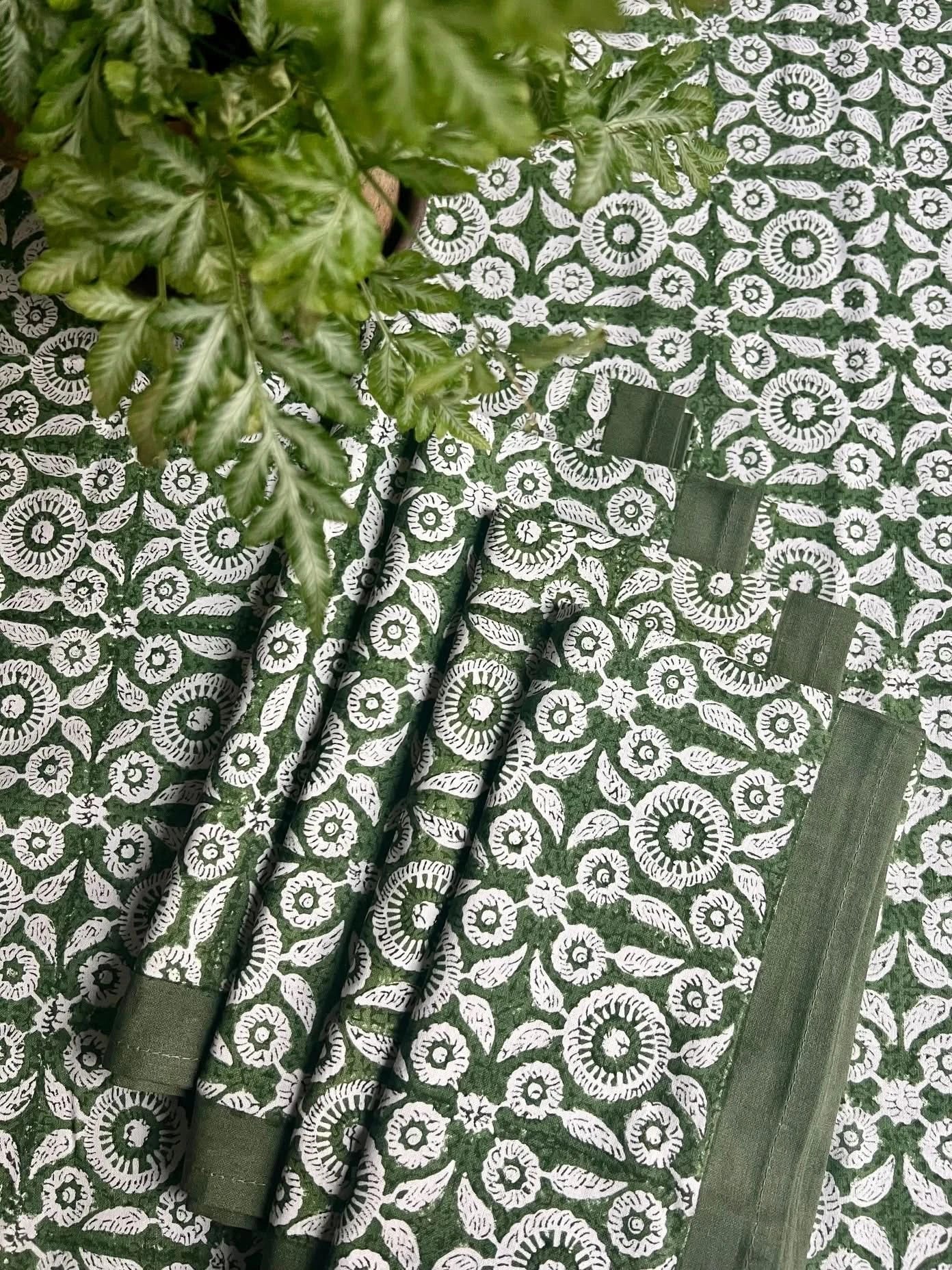 Set of 4 Feathered Tile Napkins by Christina Dickson Home with intricate feather and tile patterns in soft, elegant colors.