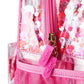 Sweet Tart Confetti Backpack by Packed Party showing colorful, playful design with adjustable straps and spacious interior.