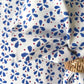 Set of four Christina Dickson Home Petals Napkins in elegant royal blue, featuring floral petal design for special occasions.