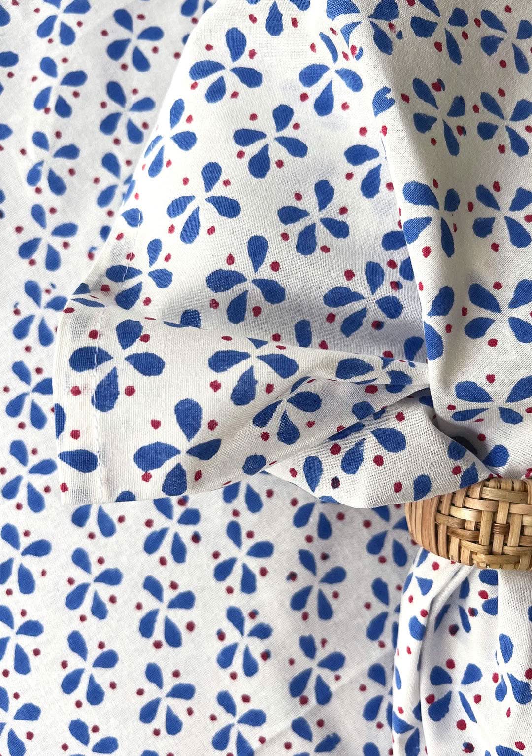 Set of four Christina Dickson Home Petals Napkins in elegant royal blue, featuring floral petal design for special occasions.