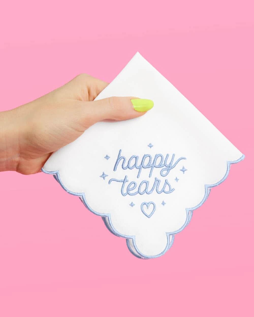Handkerchief with embroidered "Happy Tears" design by xo, Fetti, featuring delicate stitching on soft fabric.
