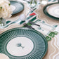 Dark green striped table runner by Gatherings, 18x120 inches, showcasing a stylish fabric with bold green and white stripes.