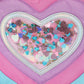 Packed Party Taylor Quilted Hearts Confetti Pencil Pouch with pink quilted fabric and colorful heart confetti design.