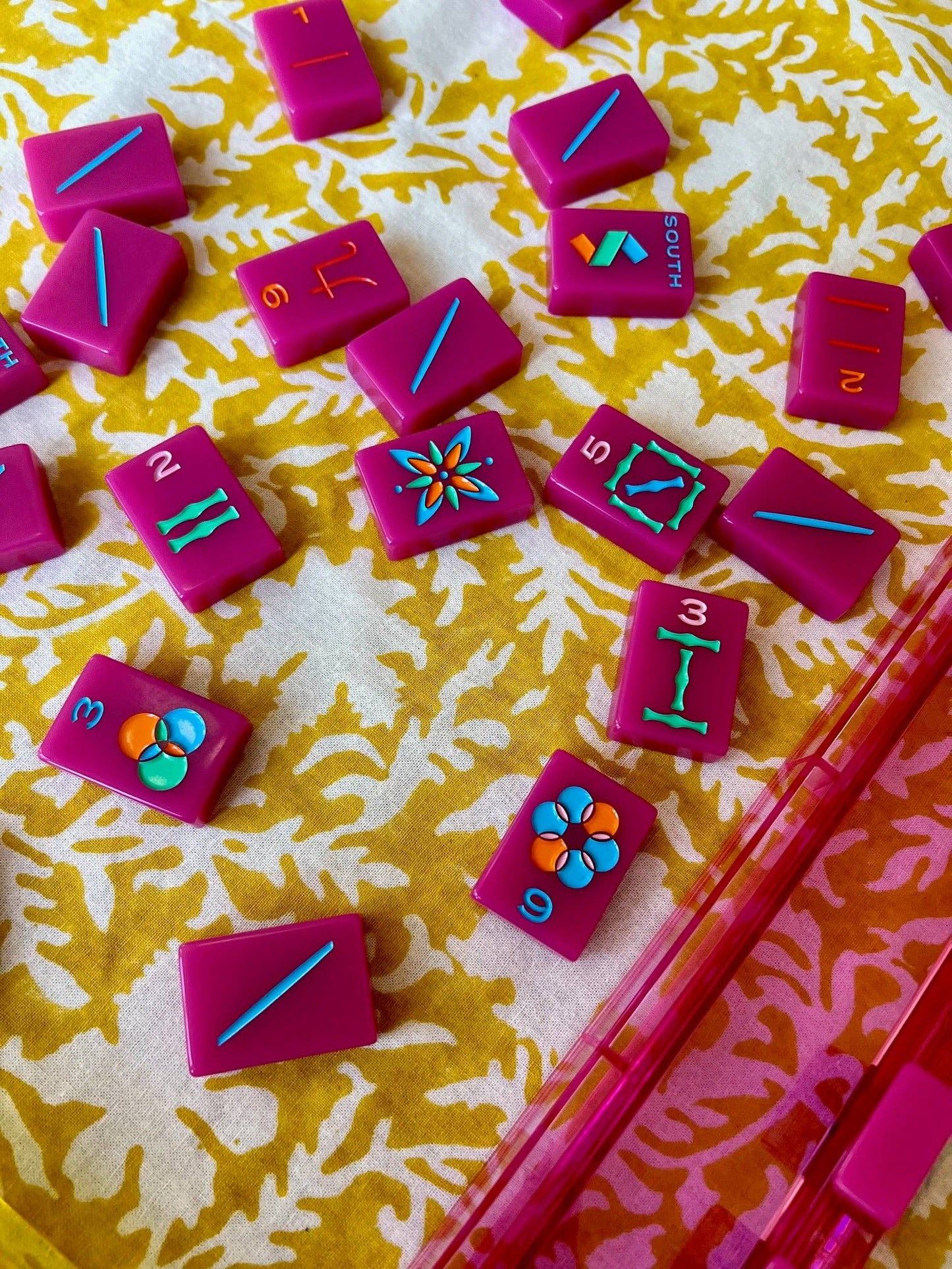 Yellow pressed floral tablecloth by Christina Dickson Home, 60x60 inches, featuring vibrant pressed floral patterns on fabric.