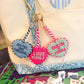 I Love Mahj needlepoint bag charm featuring colorful embroidered design, attached to a metal keyring for decorative use on bags.