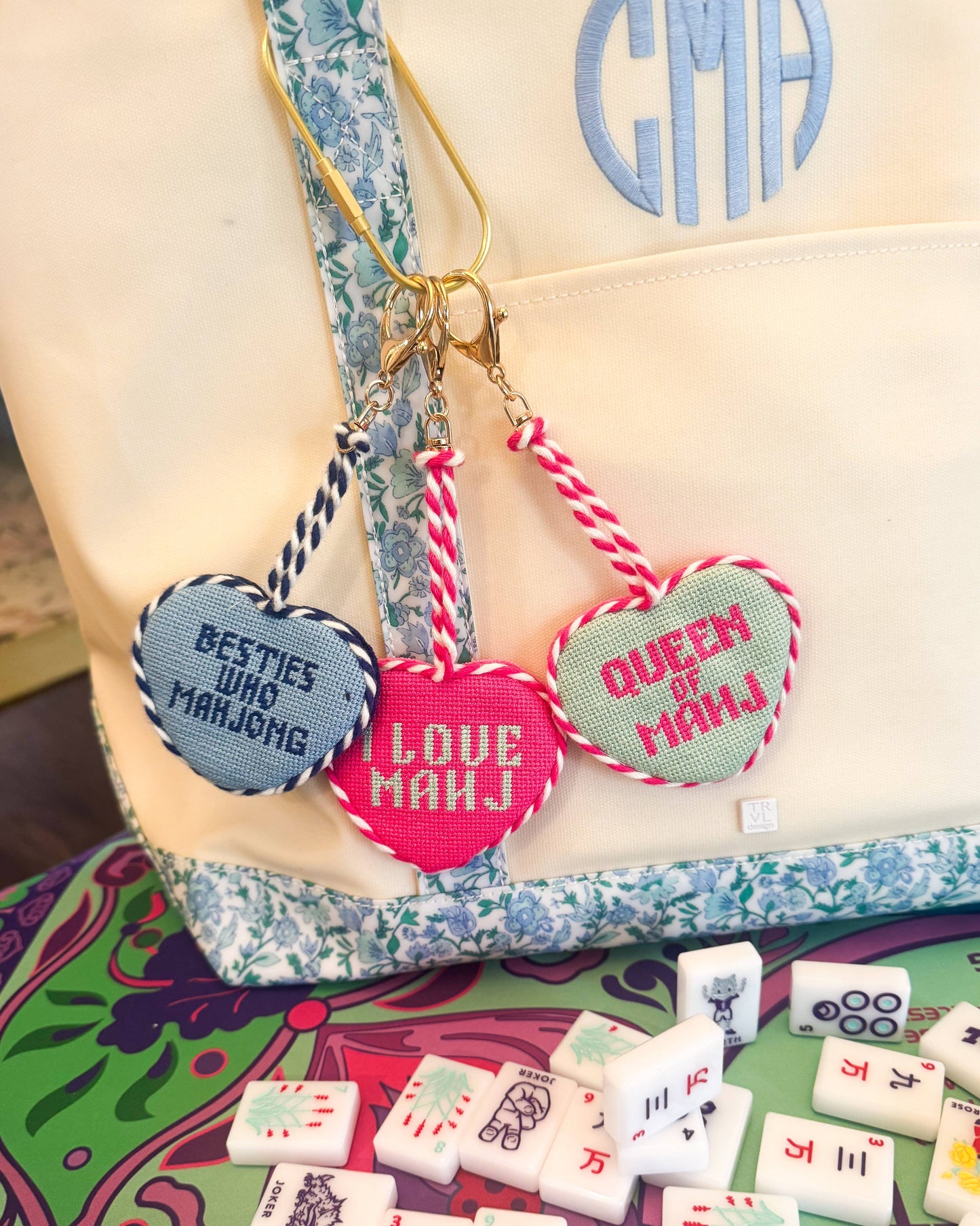 Southern Decorative Besties Who Mahjong needlepoint bag charm featuring colorful, detailed embroidery of two friends holding Mahjong tiles.